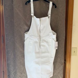 Jean dress with suspenders and front zip.